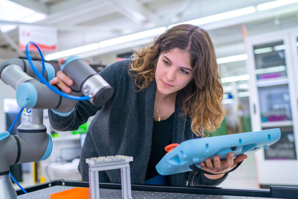 A woman working in tha lab with autonomous robots