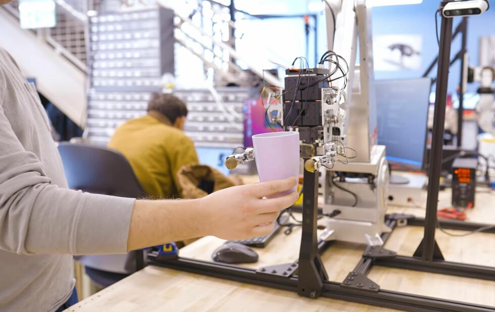 new kind of robot gripping a cup