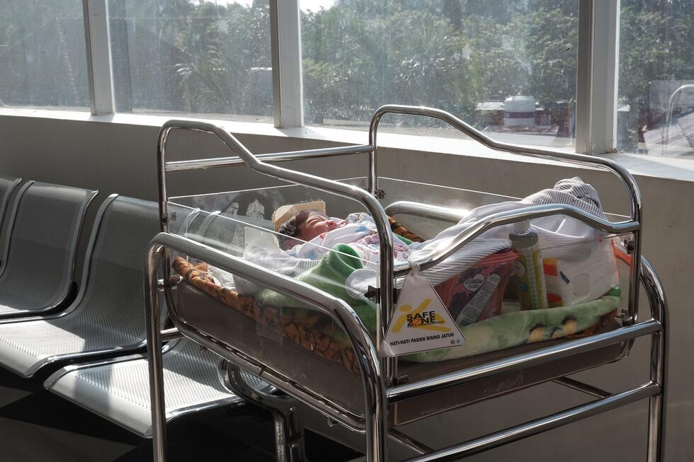 a baby in a newborn ward