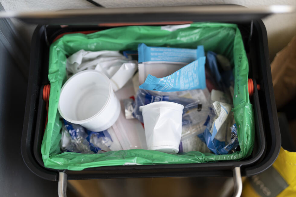 plastic waste in a garbage bin