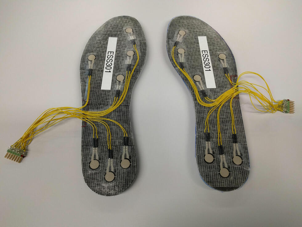 A pair of insoles with sensors